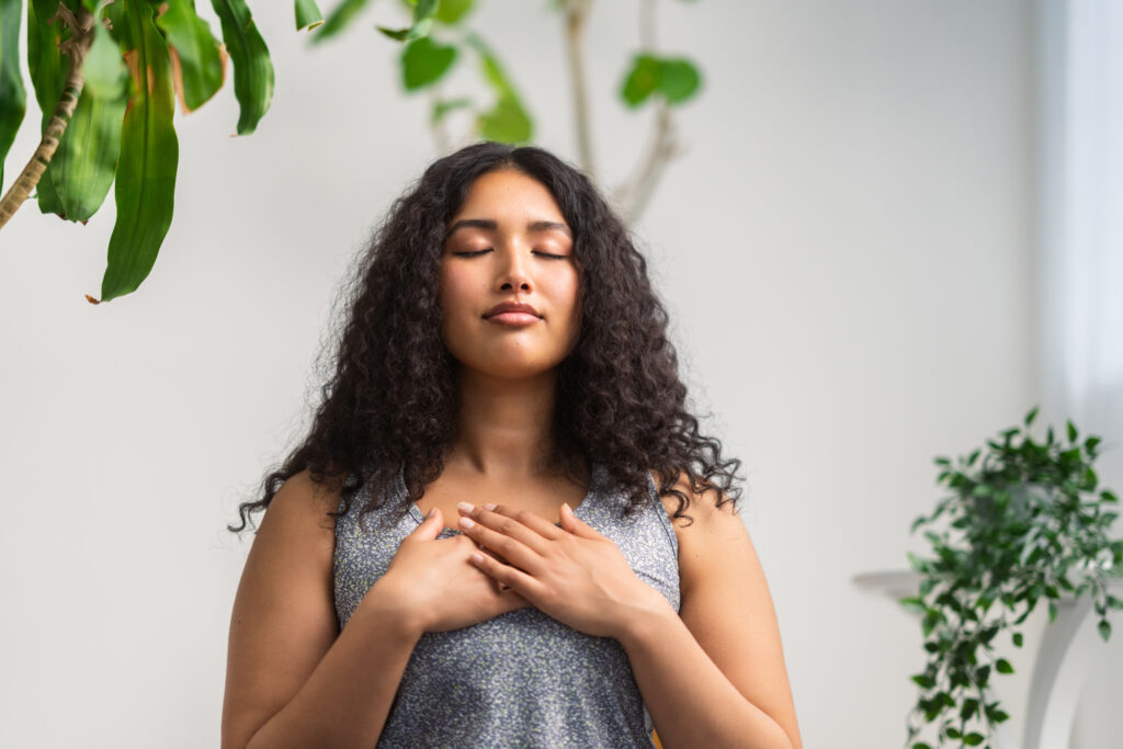 young female practicing mindfulness and self care through acceptance and commitment therapy (ACT)